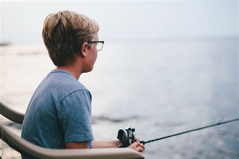 Boy Waiting To Catch A Fish Del Colaborador De Stocksy Kelly Knox