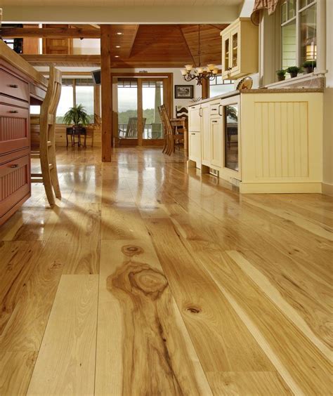 This rustic hickory flooring provides a one of a kind look that is unique because of the character of the wood. Hickory Kitchen | Wide plank hickory flooring, Hickory ...