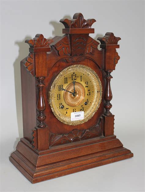 A Late 19th Century American Walnut Mantel Clock With Eight Day Movement Striking On A Gong The Gil