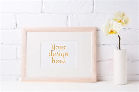 Download Wooden Landscape Frame Mockup with Soft Yellow Orchid in Vase (Graphic) by TasiPas · Creative ...