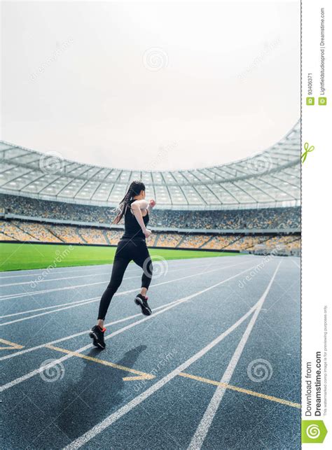 Fitness Woman In Sportswear Running On Running Track Stadium Stock