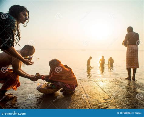 indian pilgrim doing his morning prayers in the river ganges in varanasi uttar pradesh india