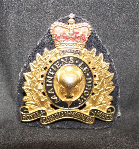 When he retired in 1968. P16. RCMP Cap badge