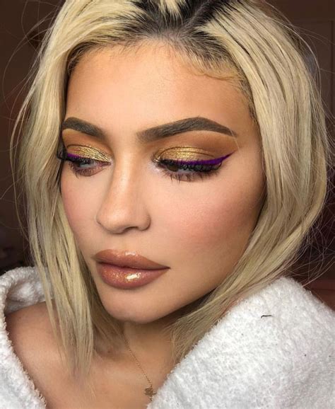 It's likely that her new style is the result of a wig, as photos posted to instagram. Kylie Jenner yellow eyeshadow and purple eyeliner makeup ...
