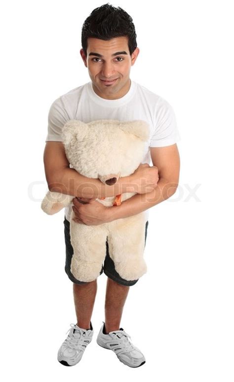 Young Man Holding Hugging A Teddy Bear Stock Image Colourbox