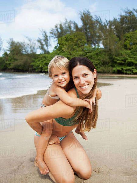 Mother With Daughter On Beach Stock Photo Dissolve