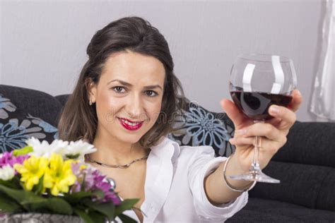 Beautiful Woman Drinking Wine Sitting On A Sofa Stock Image Image Of