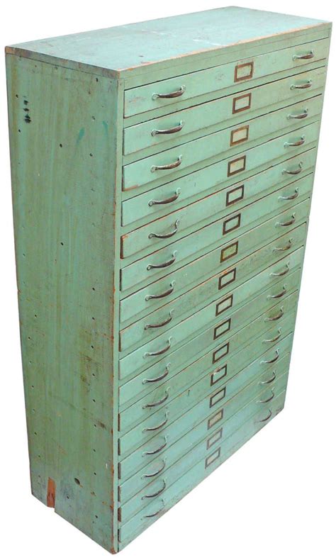 A filing cabinet (or sometimes file cabinet in american english) is a piece of office furniture usually used to store paper documents in file folders. Vintage Green Flat File Storage Cabinet at 1stdibs