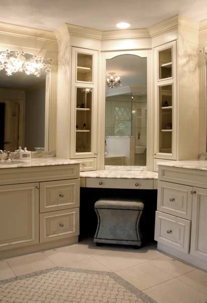 Double sink vanity is complete up of two single vanities, attached together in the central point with a counter tops table. Corner Bathroom Vanity - Traditional - bathroom - Sharon McCormick Design