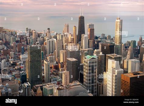 Aerial View Of Downtown Chicago Buildings And Lake Michigan At Dusk