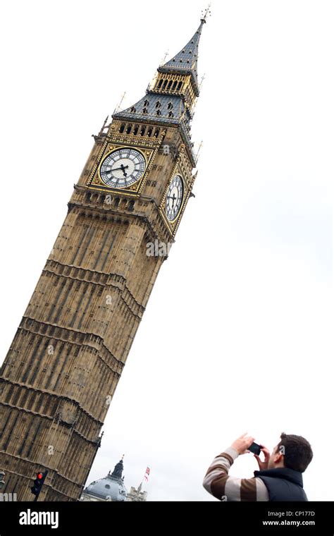 A Person Taking A Photograph Of Big Ben In London Stock Photo Alamy