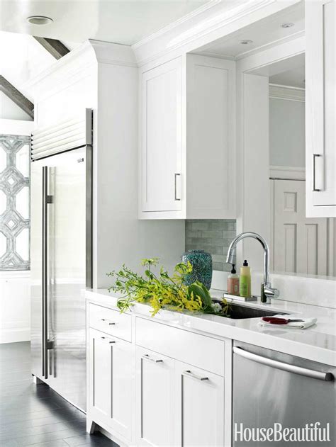 The lights by rejuvenation and kitchen aid appliances make this the perfect space for entertaining. 17 Stunning Ways To Upgrade White Kitchen Cabinets | Kitchen design, Kitchen remodel small ...