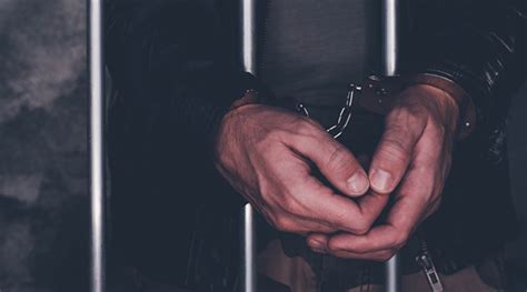 Handcuffed Man Behind Prison Bars Rmn Networks
