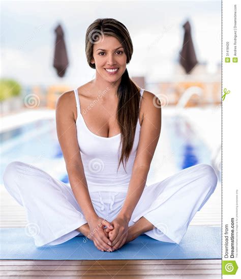 Yoga mats, yoga pants, tank tops, yoga props, sports bras Beautiful Yoga Woman Stock Photo - Image: 31418420