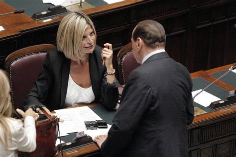 Ritratto (su sfondo azzurro) dell'ex ministra che adozioni per i single, laura ravetto (fi) deposita due proposte di legge: Laura Ravetto aspetta una bimba: l'annuncio è social - 1 ...