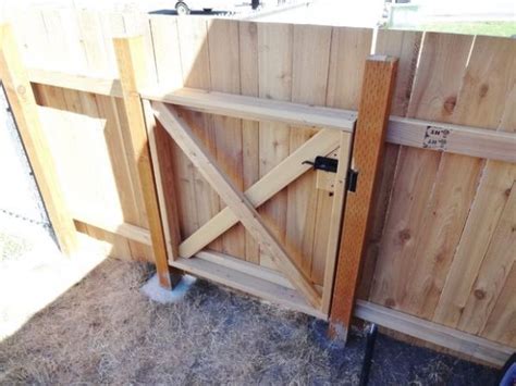 A wooden gate is the most popular for garden but you should add glass on it to make it more appealing. How to Build a Homestead Wooden Fence Gate | The Homestead ...