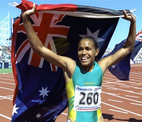 4 Cathy Freeman Carries The Aboriginal And Australian Flags On Victory