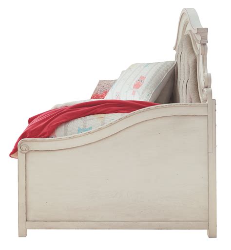 A curvaceous beauty this brilliant upholstered bed wows with a distressed chipped white finish for heirloom appeal. Realyn Twin Day Bed with Storage by Signature Design by ...