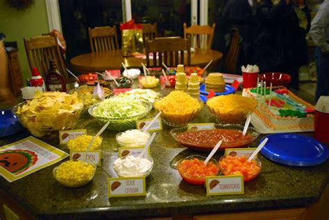 I always love covering the table in either butcher paper or wrapping paper. Taco Salad Bar | Taco salad bar, Taco bar party, Taco bar