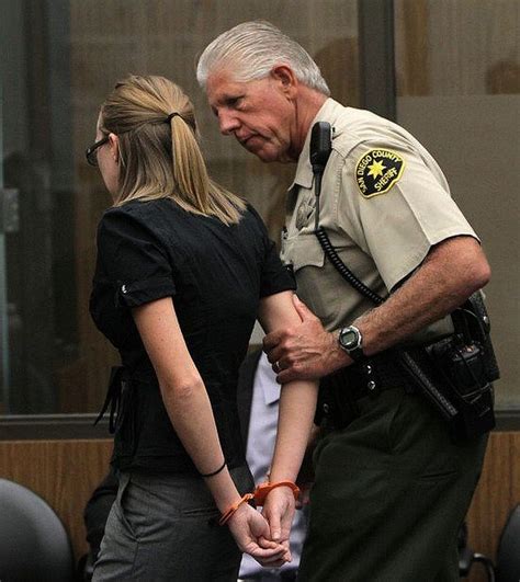 Woman In Orange Handcuffs Behind Back Led By Police Officer Handschellen