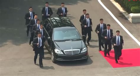 Watch 12 Bodyguards Run Alongside Kim Jong Uns Mercedes Limo