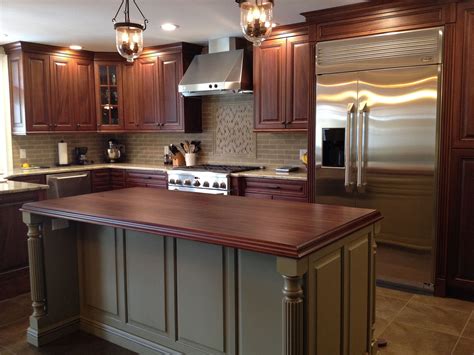 If you are after grey kitchen ideas try. Two tone kitchen. Island has a wood counter top to match ...