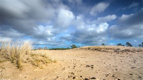Moving Cloudy Sky At A Sandy Dessert Stock Photo Image Of Hillock