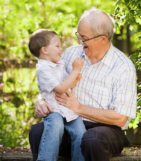 Caucasian Grandfather Talking With Grandson Stock Photo Dissolve