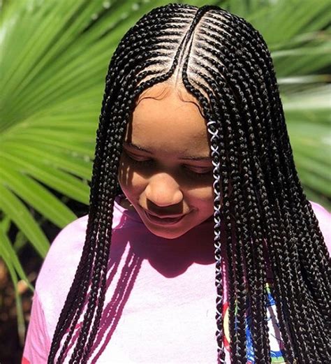 This hairstyle is having cornrow braids over the head top with the straightened hairs available over the back. 7 Popular Cornrow Braid Styles Used By the People | Styles ...