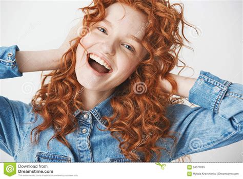Happy Cheerful Redhead Girl Smiling Rejoicing Looking At Camera With Opened Mouth Over White