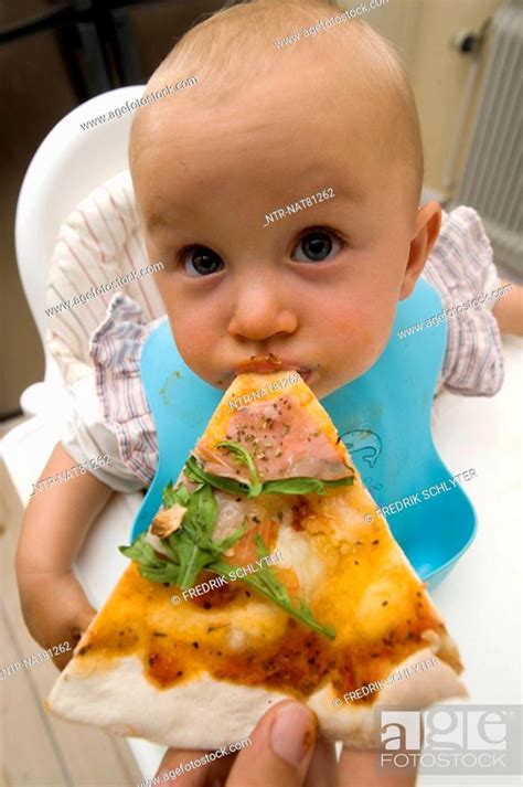 A Baby Eating Pizza Sweden Stock Photo Picture And Royalty Free