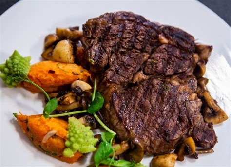 Grilled rib eye steak is a favorite among man because it is a juicy tender steak that is quick and easy to make. Rib-eye steak with sweet potatoes and mushrooms