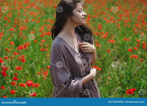 Stylish Sensual Woman In Rustic Dress Relaxing In Red Poppy Field