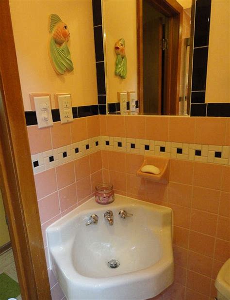 During the 1950s and 60s, midcentury home design included a distinctive feature hoping to find a retro sink and vanity to match this tiling? 37 1950s pink bathroom tile ideas and pictures