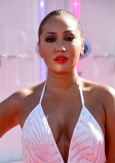 Adrienne Bailon Shows Huge Cleavage Wearing A Bareback Maxi Dress At