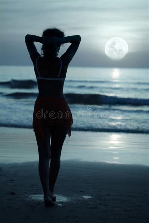 Moonlight Woman On The Beach Under Moonlight At Night Time