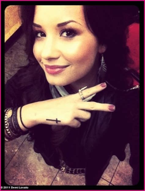 demi lovato cross tattoo on her hand meaning of the religious tattoo trendy tattoos love