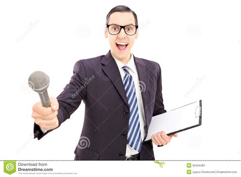 This person from the company is the interviewer. Excited Young Male Interviewer In Suit Holding Microphone ...