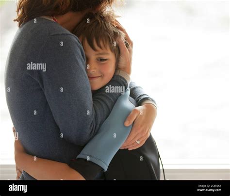 Mother And Son Hugging Stock Photo Alamy