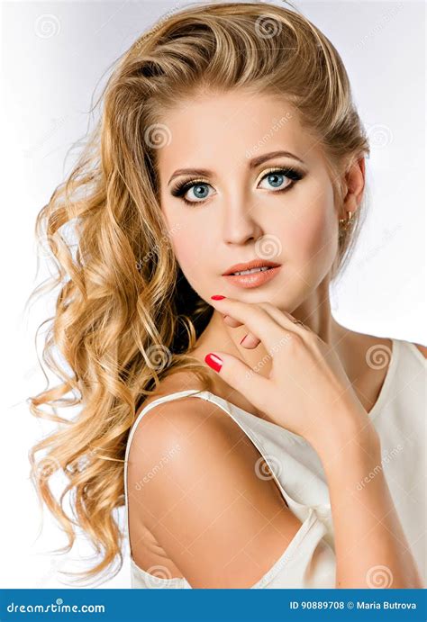 portrait of an attractive cute girl blonde with clean and well groomed skin delicate makeup in a