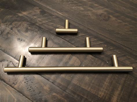 I have been planning a fabulous wet bar f… Champagne Bronze Cabinet Hardware | Backsplash kitchen white cabinets, Cabinet hardware bronze ...