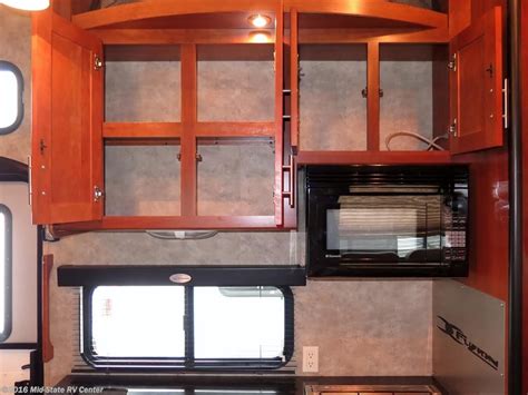 Pin By Mid State Rv Center On Toy Haulers Home Kitchen Cabinets Decor