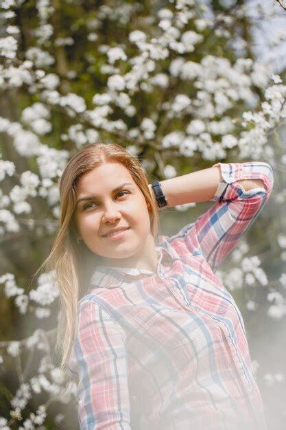 Premium Photo Beautiful Girl In Flowering Trees In Early Spring