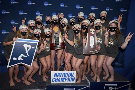 The Womens Tennis Team Is Posing With Their Trophies And Wearing Masks