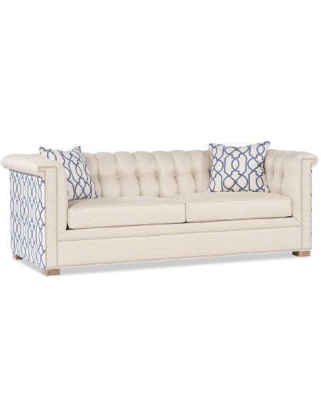 Not only is fresh air fantastic for most upholstered items every once in a while, but the sun can also actually help lighten and bleach away stains! White Upholstered Sofa with patterned side