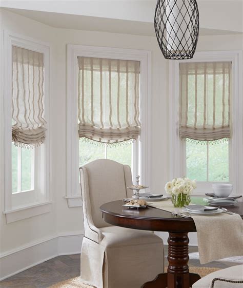 Roman shades and drapes add elegance and depth. Shades - Relaxed Roman Shade -The Fabric Mill
