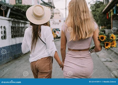Two Lesbians Walking Down The Street Holding Hands Stock Image Image