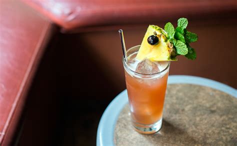 Strain into the prepared collins glass. Singapore Sling - PUNCH