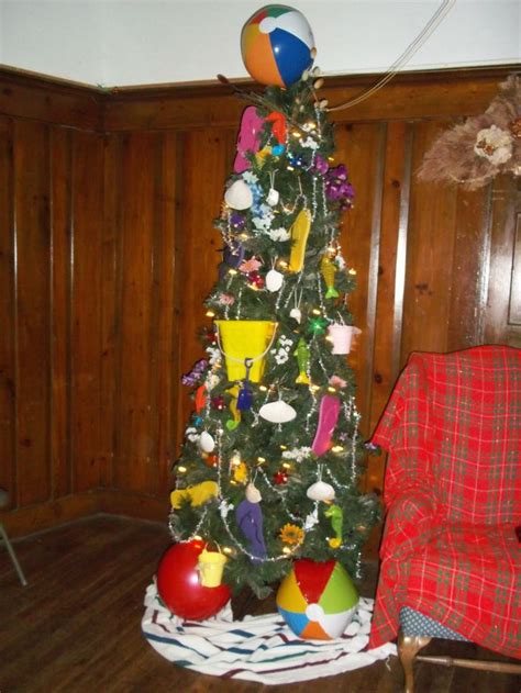 Adidas, nike, apple, jack wolfskin, samsung, playstation, lego Florida summer themed Christmas tree. Beach balls, flip ...
