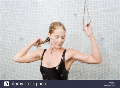 Woman In Bathing Suit Taking Shower Stock Photo Alamy